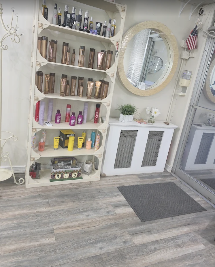 Inside Phyllis Salon showing styling products and mirror