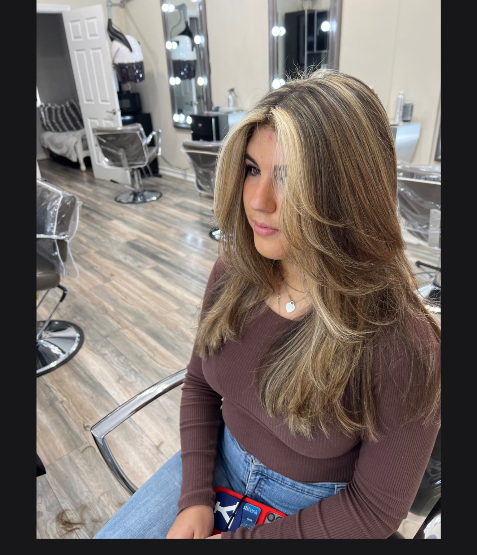 Long blonde balayage waves styled at Phyllis Salon